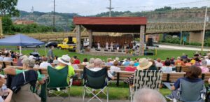 An audience enjoying an outdoor concert in Steubenville