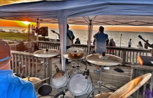 a rock band plays overlooking the lake in Vermillion