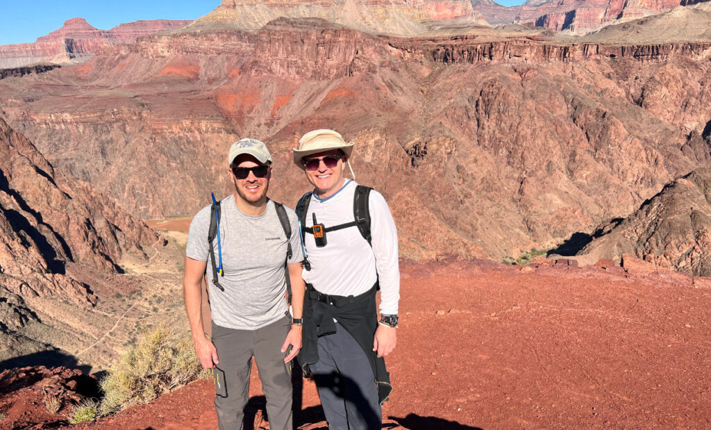 The author and a friend posing for a photo overlooking the Grand Canyon