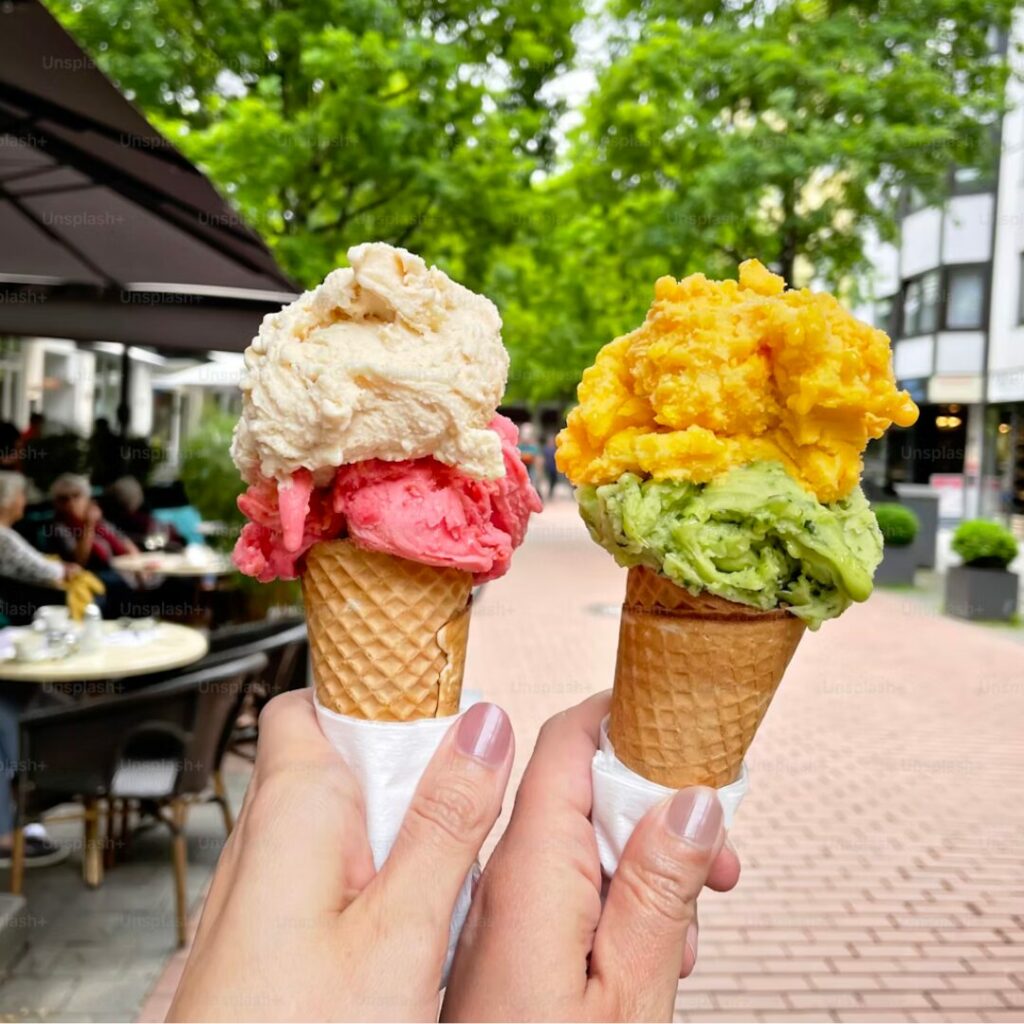 Two cones of ice cream with two scoops each
