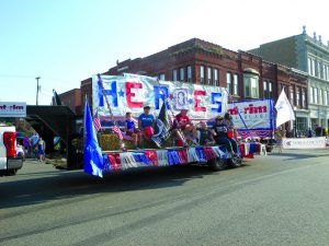 A float with the name heroes above it for the Firemens Festival Noble County OHio
