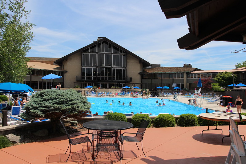 An image of the patio facing the lodge at Ohio State Park Salt fork and it's outdoor swimming pool