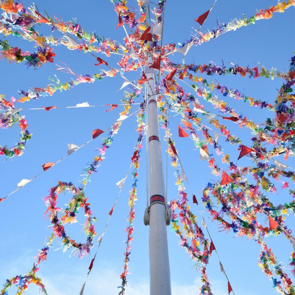 Image of a May pole celebrating May inspired by Maia, Greek Goddess of Fertility